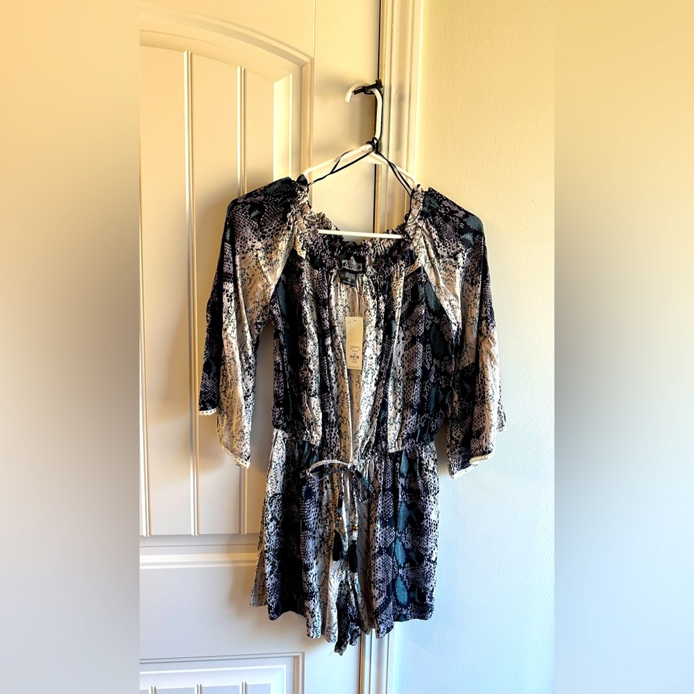 Francesca’s Jumpsuit/Romper; very cute and stylish. A must have item.